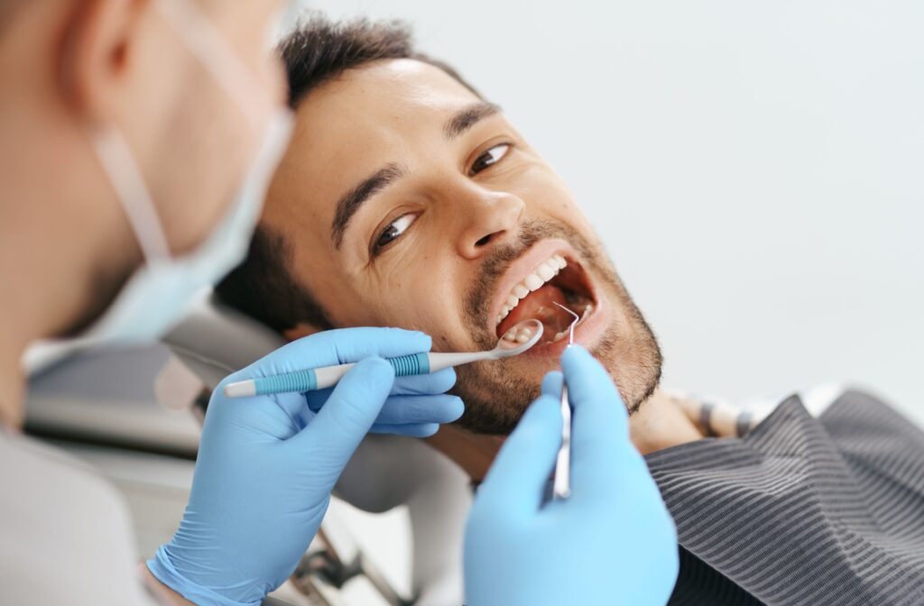 A man having his teeth examined by a dentist in Mexico.