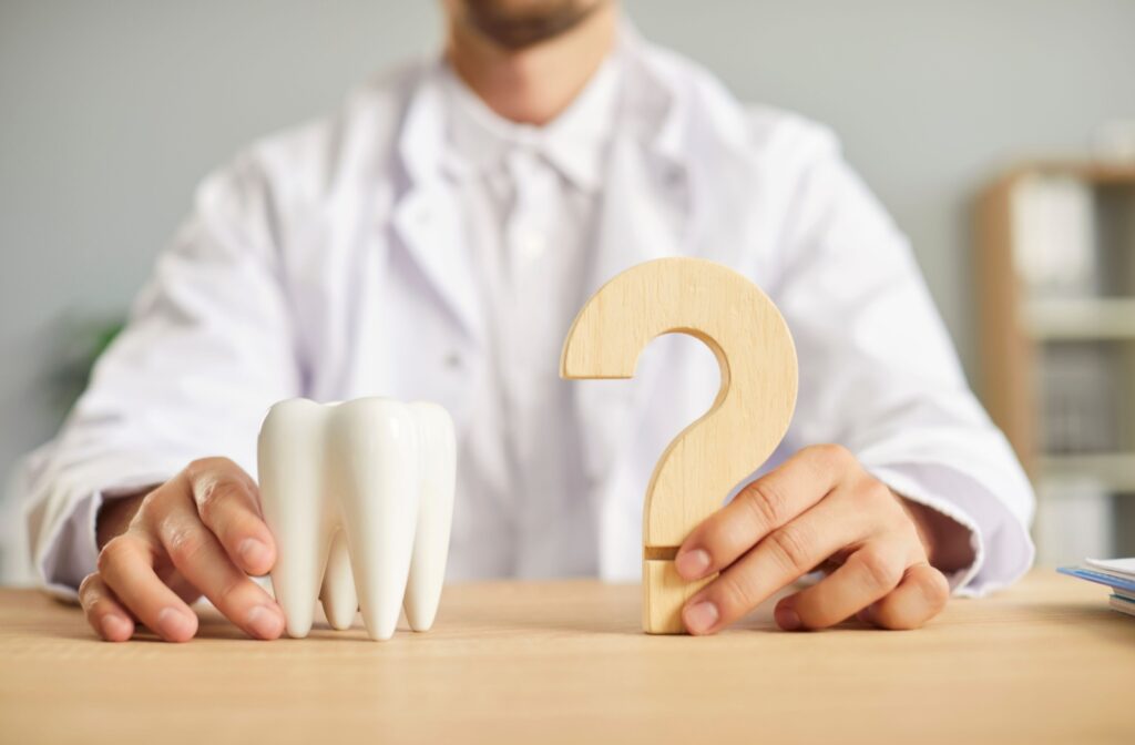 wooden question mark with tooth